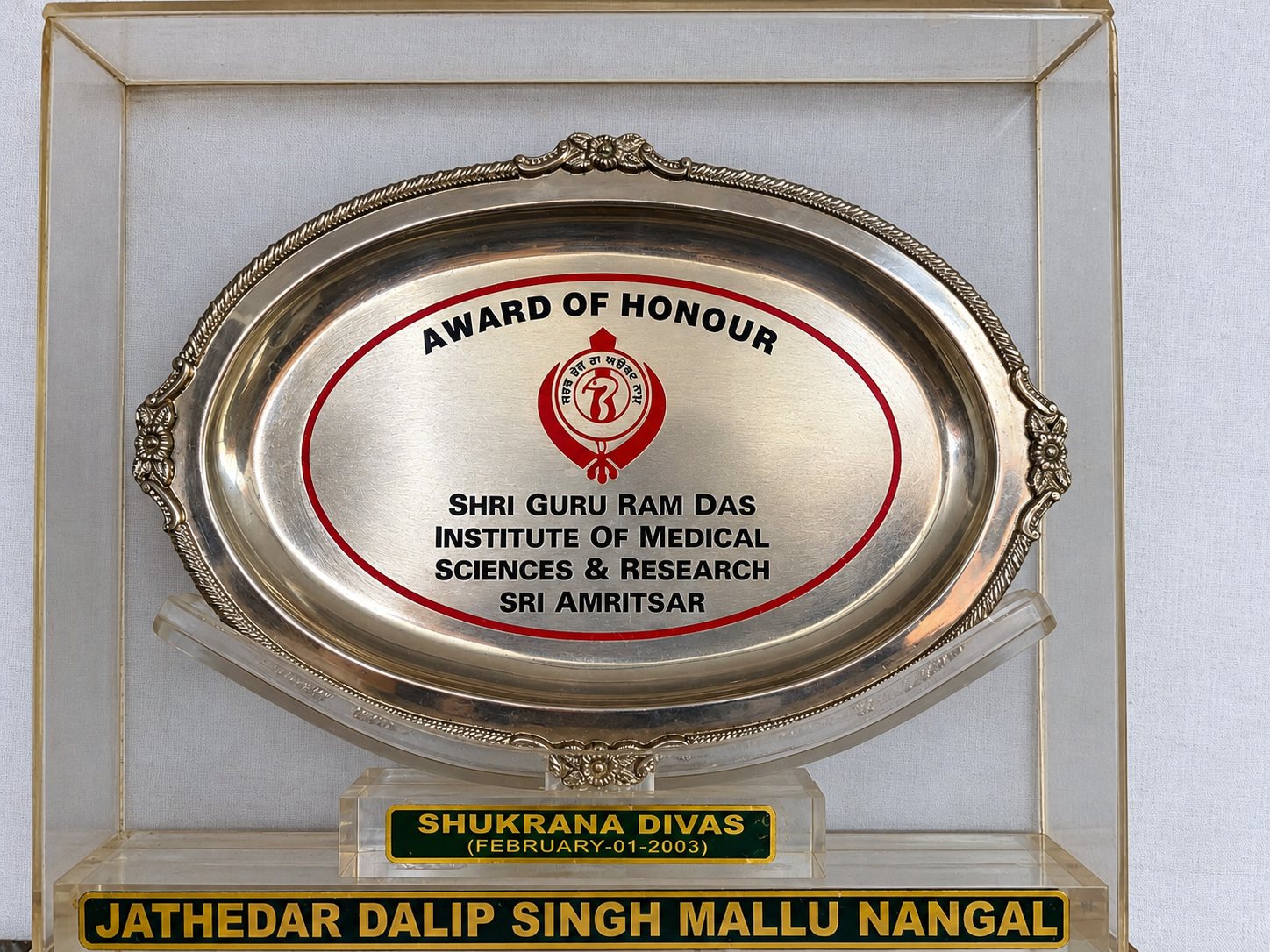Award of Honour from Sri Guru Ram Das Institute of Medical Sciences & Research, Sri Amritsar. The base reads Jathedar Dalip Singh Mallu Nangal, Shukrana Divas, 1 February 2003.