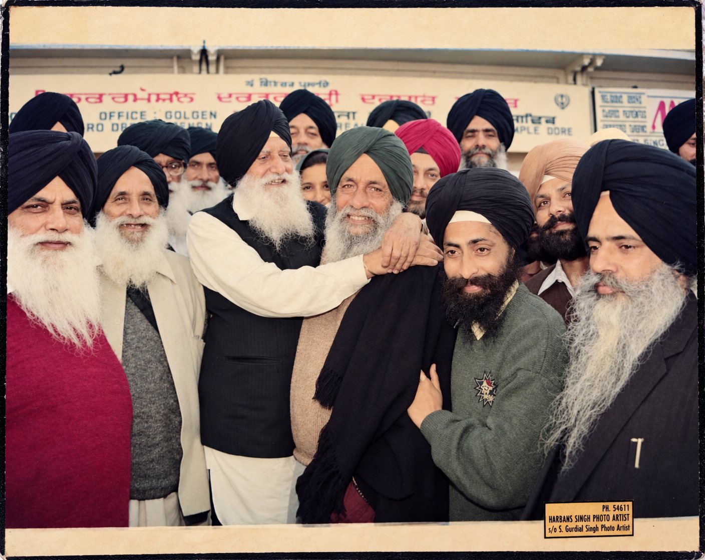 Gathering photograph supplied with Jathedar Dalip Singh Ji’s papers. The print is marked Harbans Singh Photo Artist, s/o S. Gurdial Singh Photo Artist, PH. 54611. The individuals are not labelled.